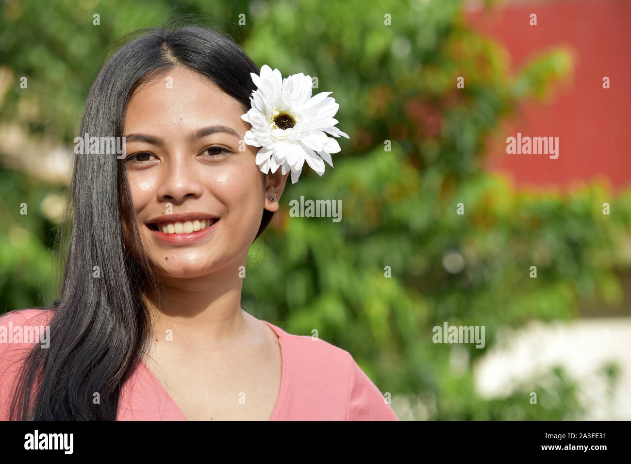 Beautiful Filipina Woman And Happiness With Flowers Stock Photo - Alamy