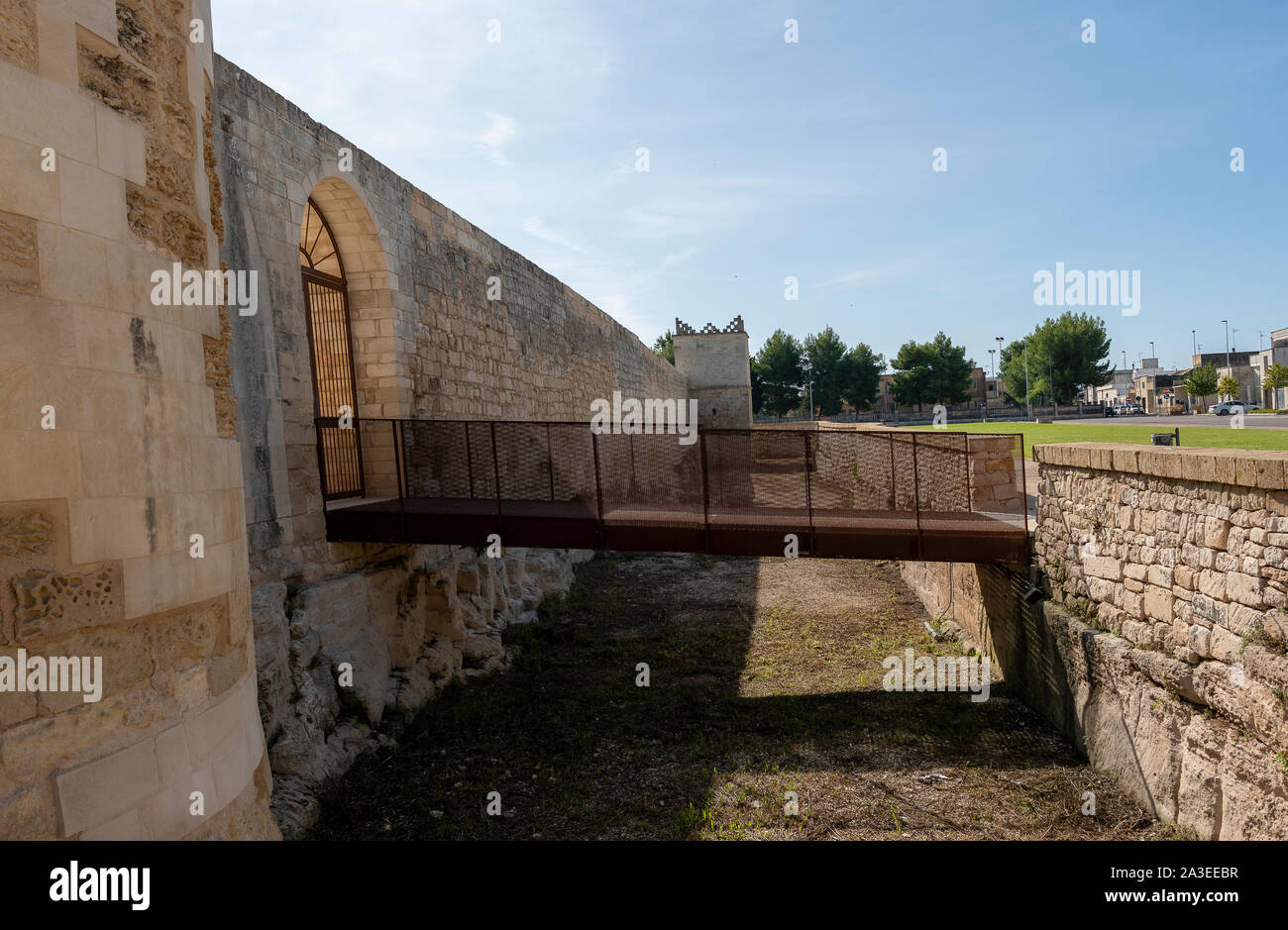Melpignano. Greek city. Aragonese Castle, view of the perimeter walls and of the ancient phosphate. Pedestrian walkway accessing the castle. Stock Photo