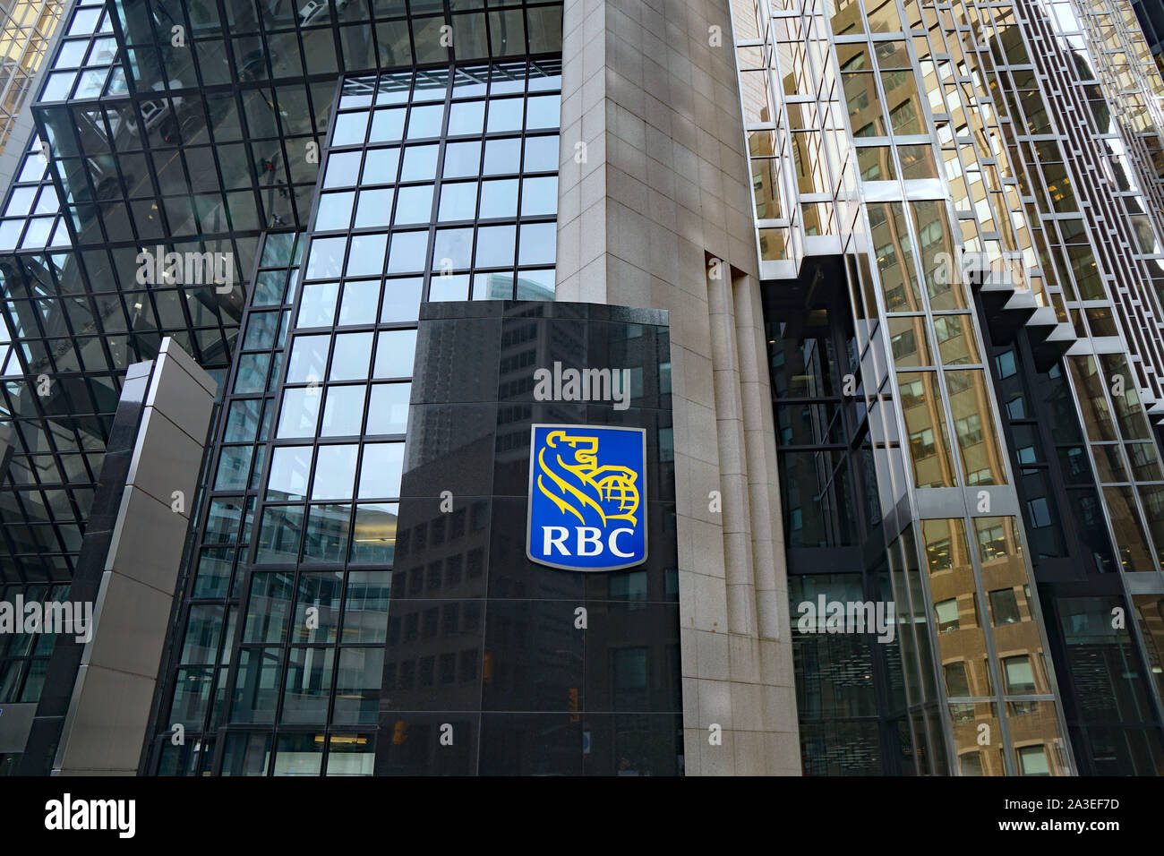TORONTO - OCTOBER 2019:  The logo of RBC, Canada's largest banking company, on its modern head office building in Toronto's financial district. Stock Photo