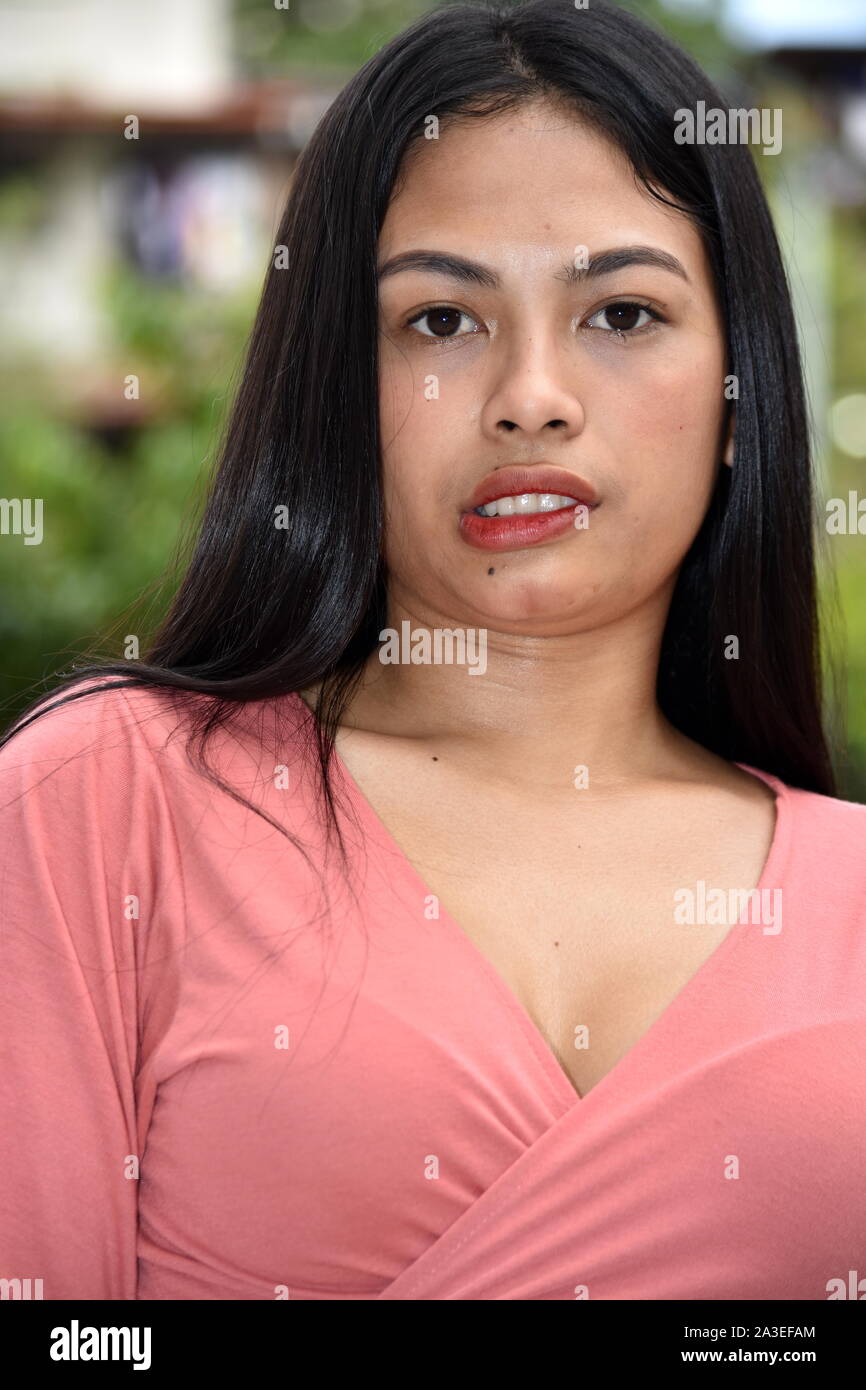 An Asian Female Smirking Stock Photo