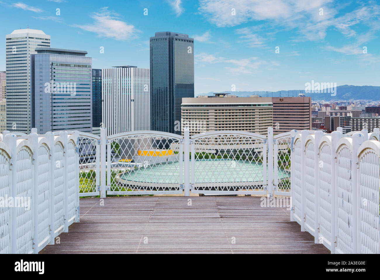 White balcony with perspective wood floor on city background Stock Photo -  Alamy