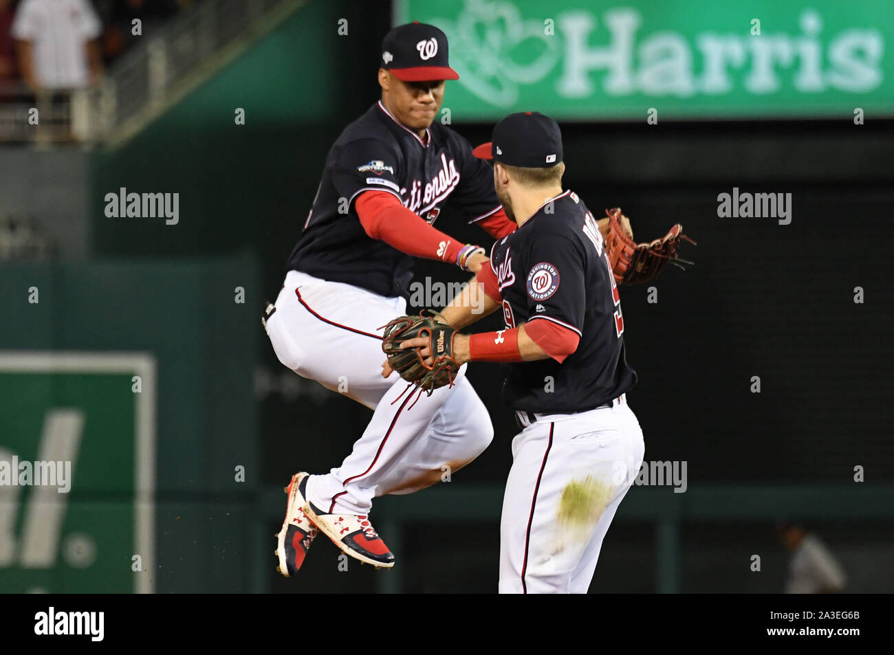 Washington, United States. 07th Oct, 2019. Washington Nationals' Juan Soto  (L) leaps toward Brian Dozier (9) to celebrate a 6-1 won over the Los  Angeles Dodgers during game 4 of the NLDS