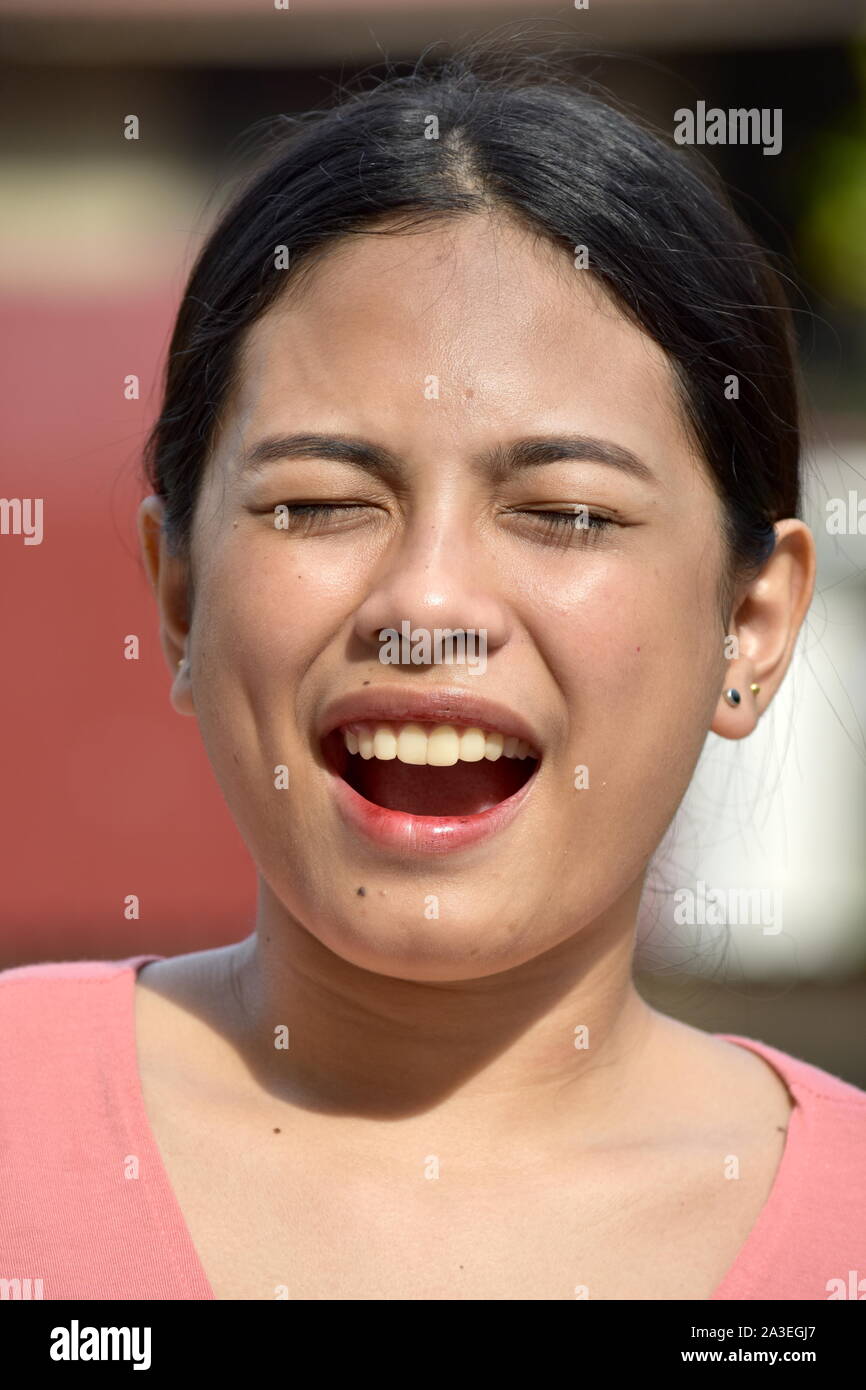 Beautiful Filipina Adult Female With Eyes Closed Stock Photo
