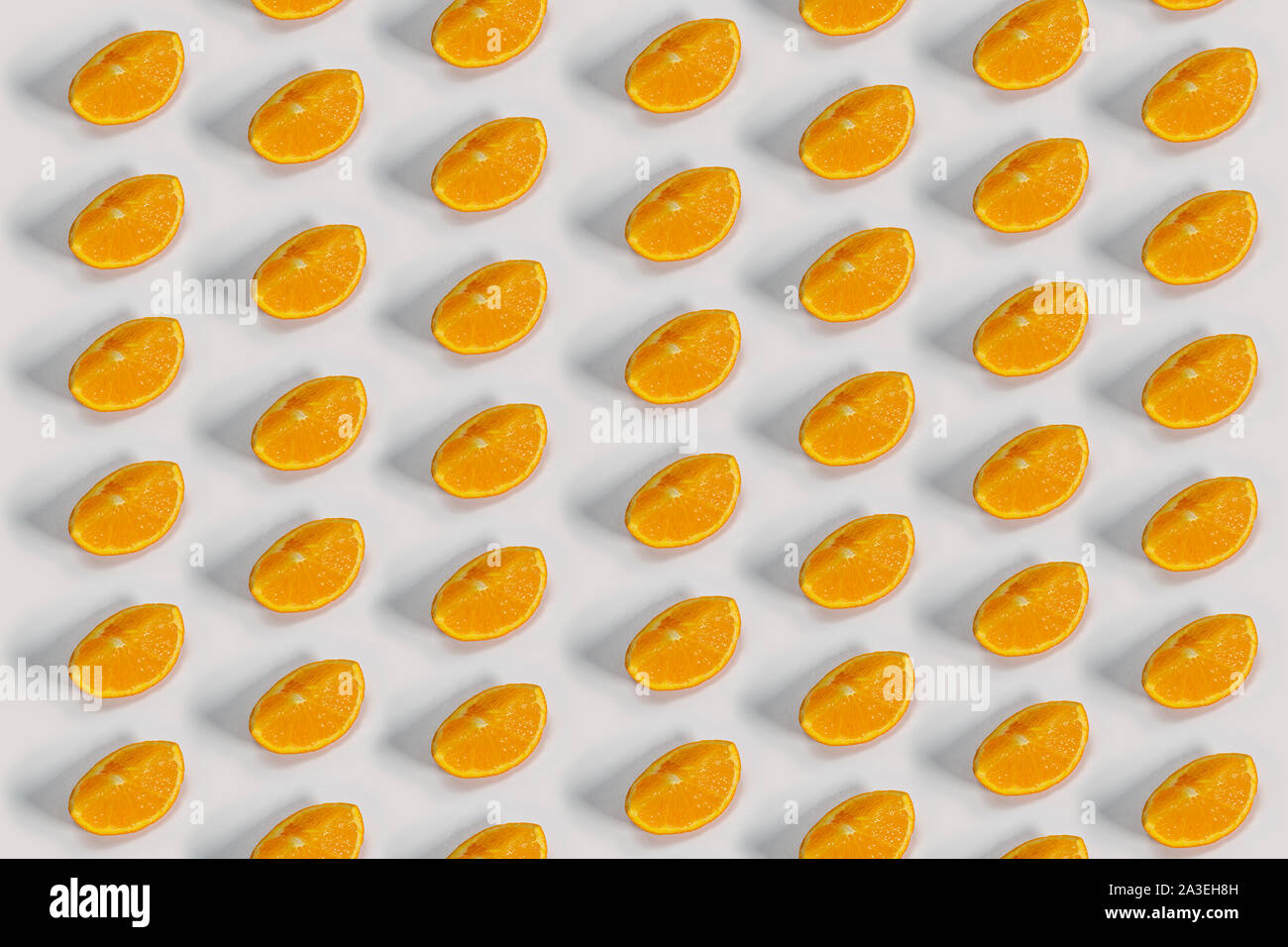 Oranges slides with a shadow on a white background Stock Photo