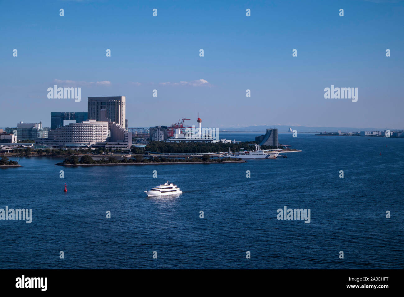View of the Tokyo Bay during the day from the Rainbow Bridge in Odaiba. Busy waterway with ships. Landscape Orientation. Stock Photo