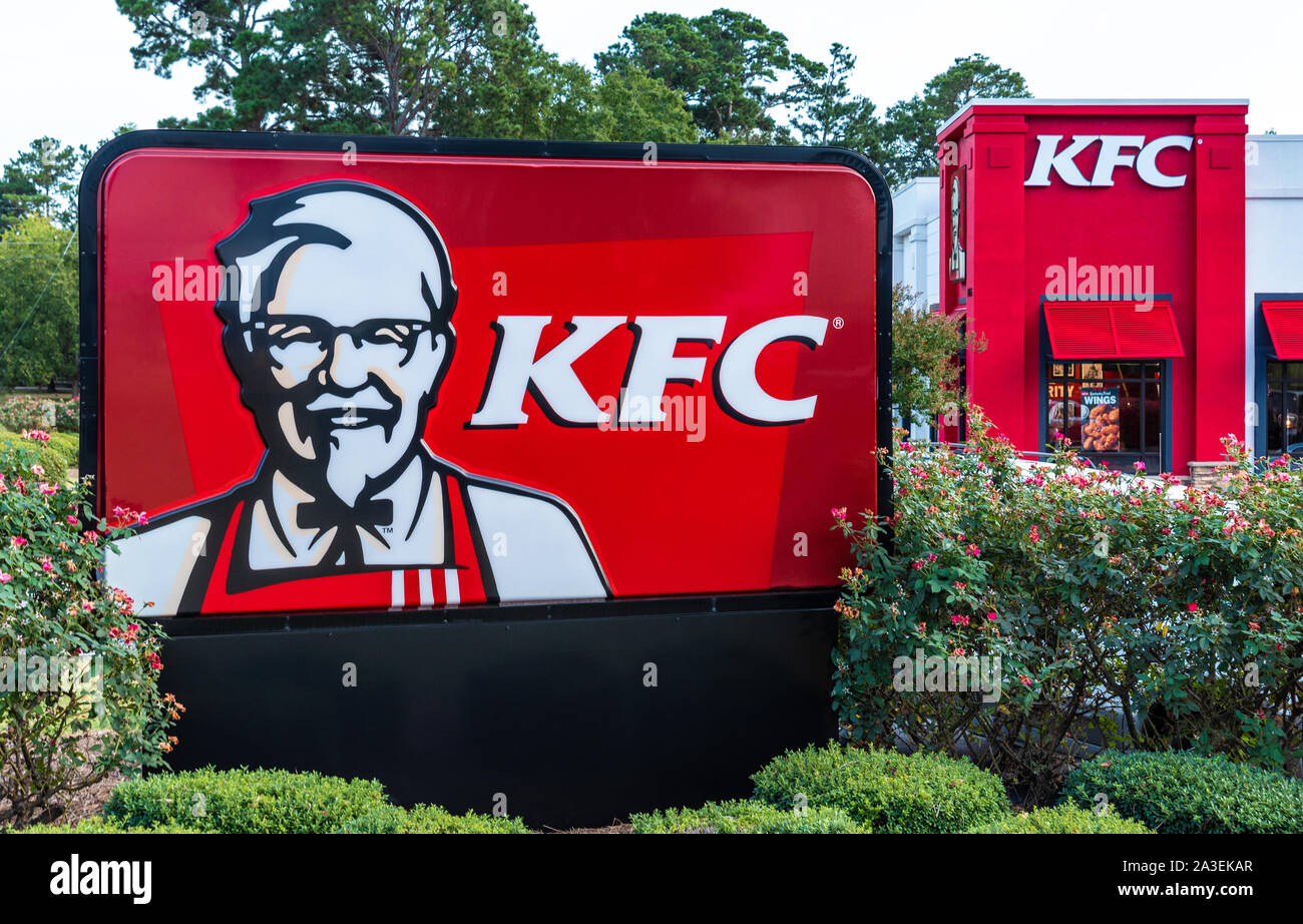 KFC fast-food restaurant, with signage featuring Colonel Sanders, in Loganville, Georgia. (USA) Stock Photo
