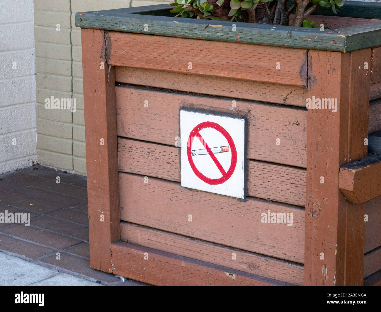 Cigarette crossed out no smoking sign on outdoor area Stock Photo