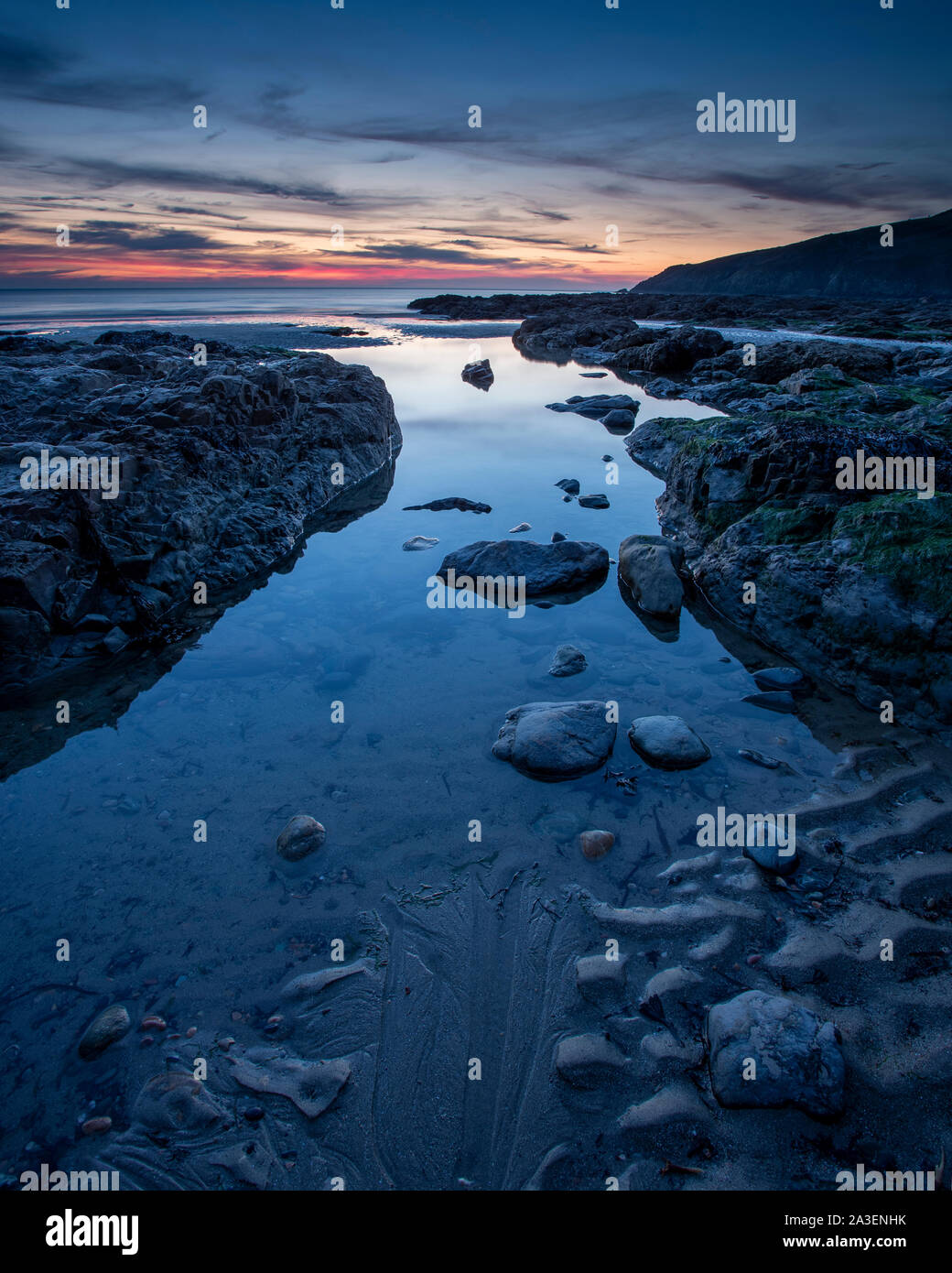 Dusk over Church Bay on the coast of Anglesey, North Wales Stock Photo