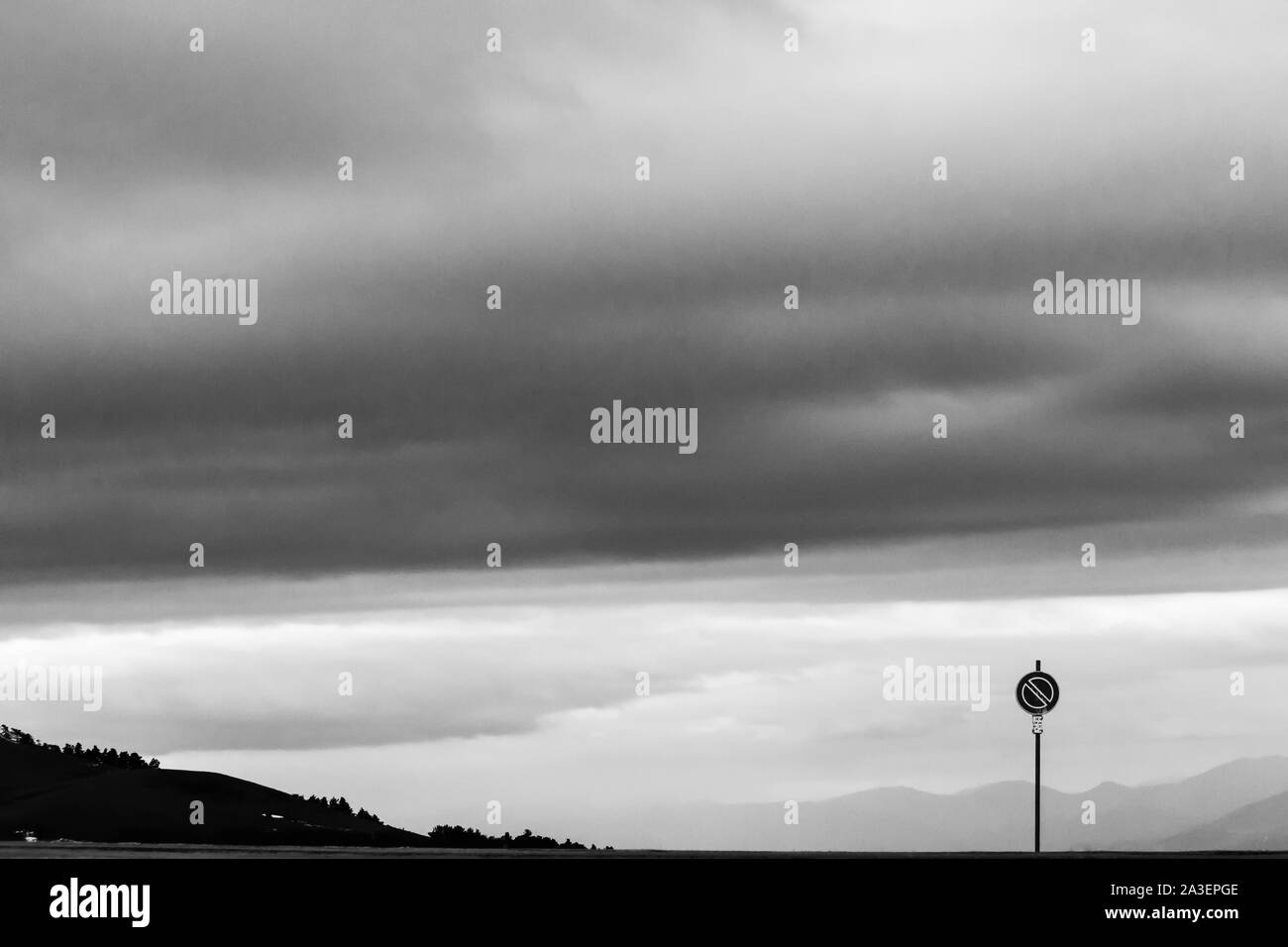 Road sign against a moody sky background with big clouds Stock Photo ...