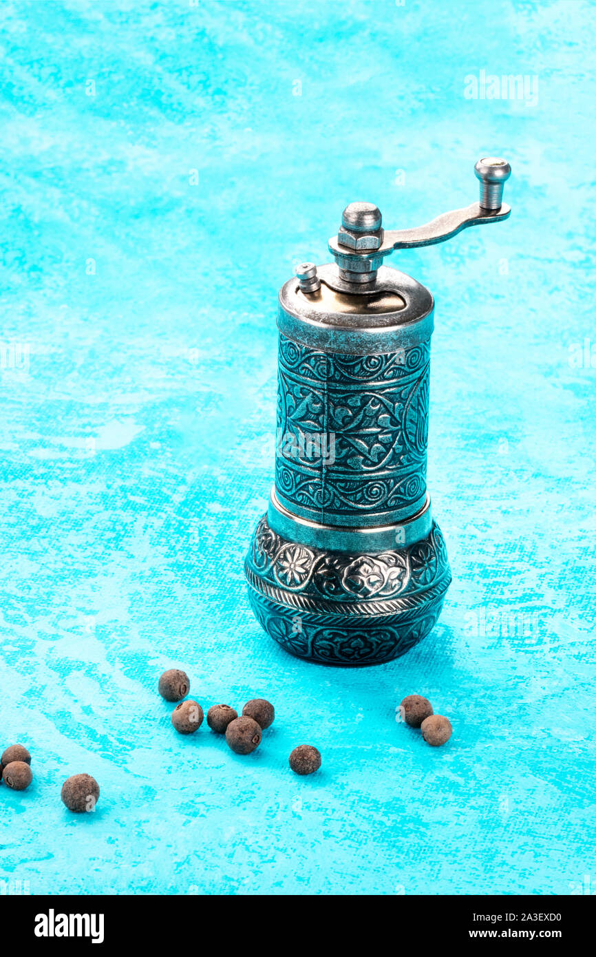 Allspice, Jamaican pepper. Scattered peppercorns with a vintage pepper