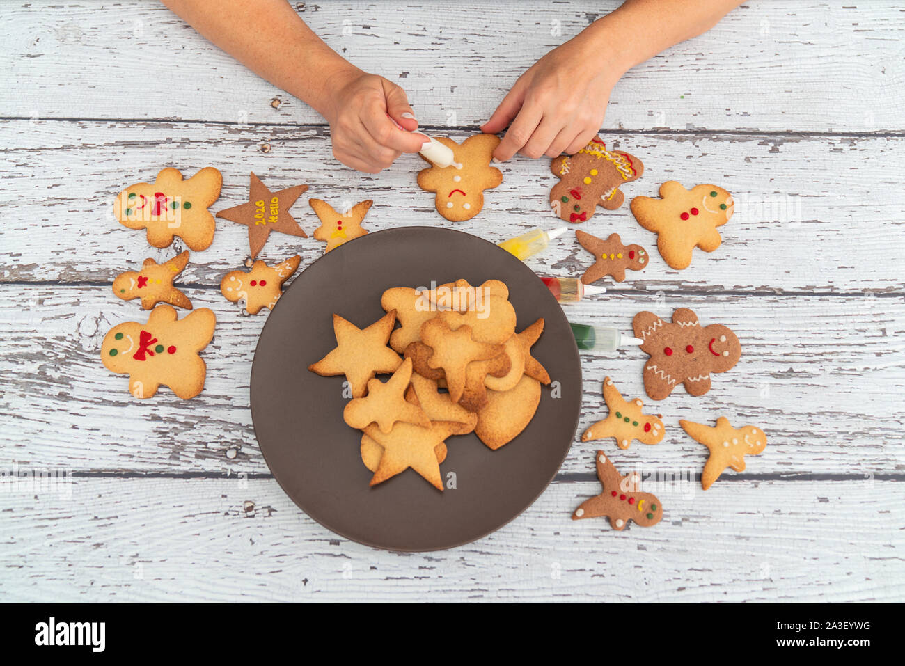 Preparing traditional gingerbread cookies for new year celebration. Stock Photo
