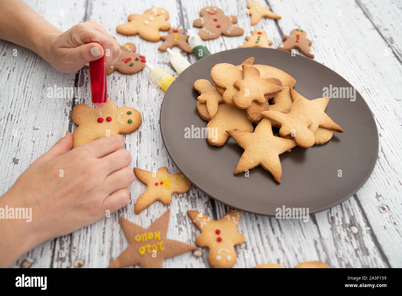Preparing traditional gingerbread cookies for new year celebration. Stock Photo