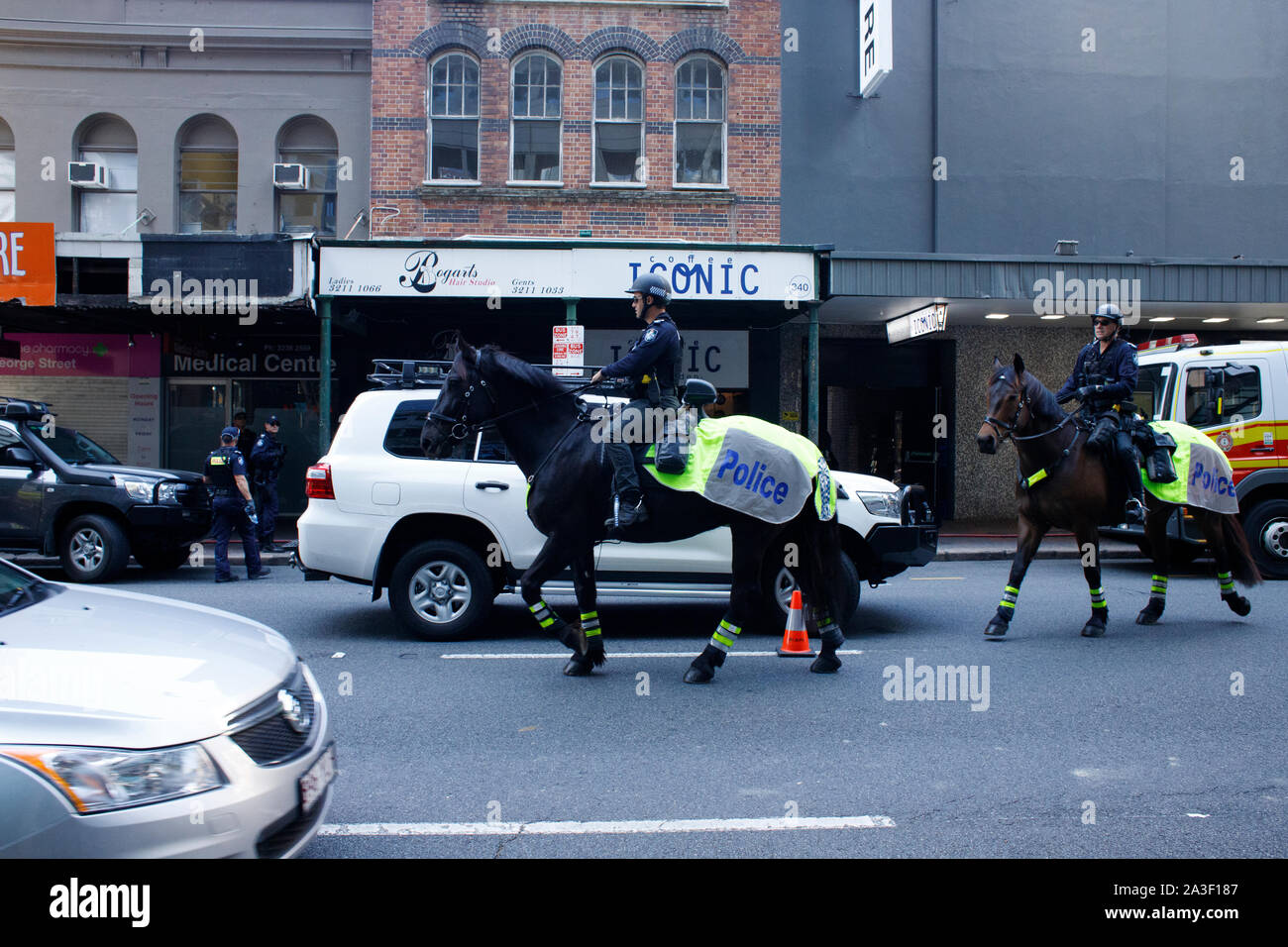 Queensland Police on horseback approach the scene of Extinction Rebellion protests on George Street during the second day of the Rebellion Week protest.Climate change activism group Extinction Rebellion have amassed members in around seventy countries, and during their 'Rebellion Week' they planned to cause continued disruption to business and roads as a means to force government policy change when it comes to environmental and climate change issues. On this second day of the Rebellion Week, numerous individuals sought to cause disruptions in the Brisbane Central Business District. Stock Photo