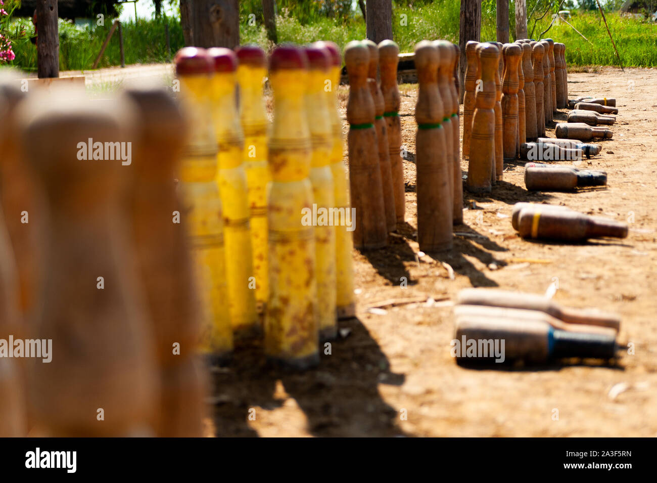 close up of bitlles catalanes, a traditional catalan bowling game where wooden pins, 'bolos catalanes' are used, in countryside outdoor Stock Photo