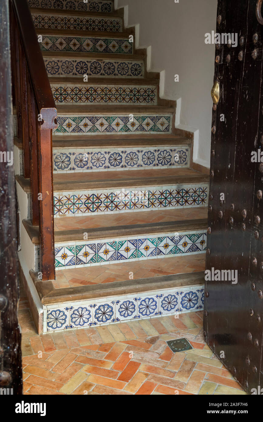 Traditional Moroccan stairs decorated with tiles in Asilah, Morocco Stock Photo