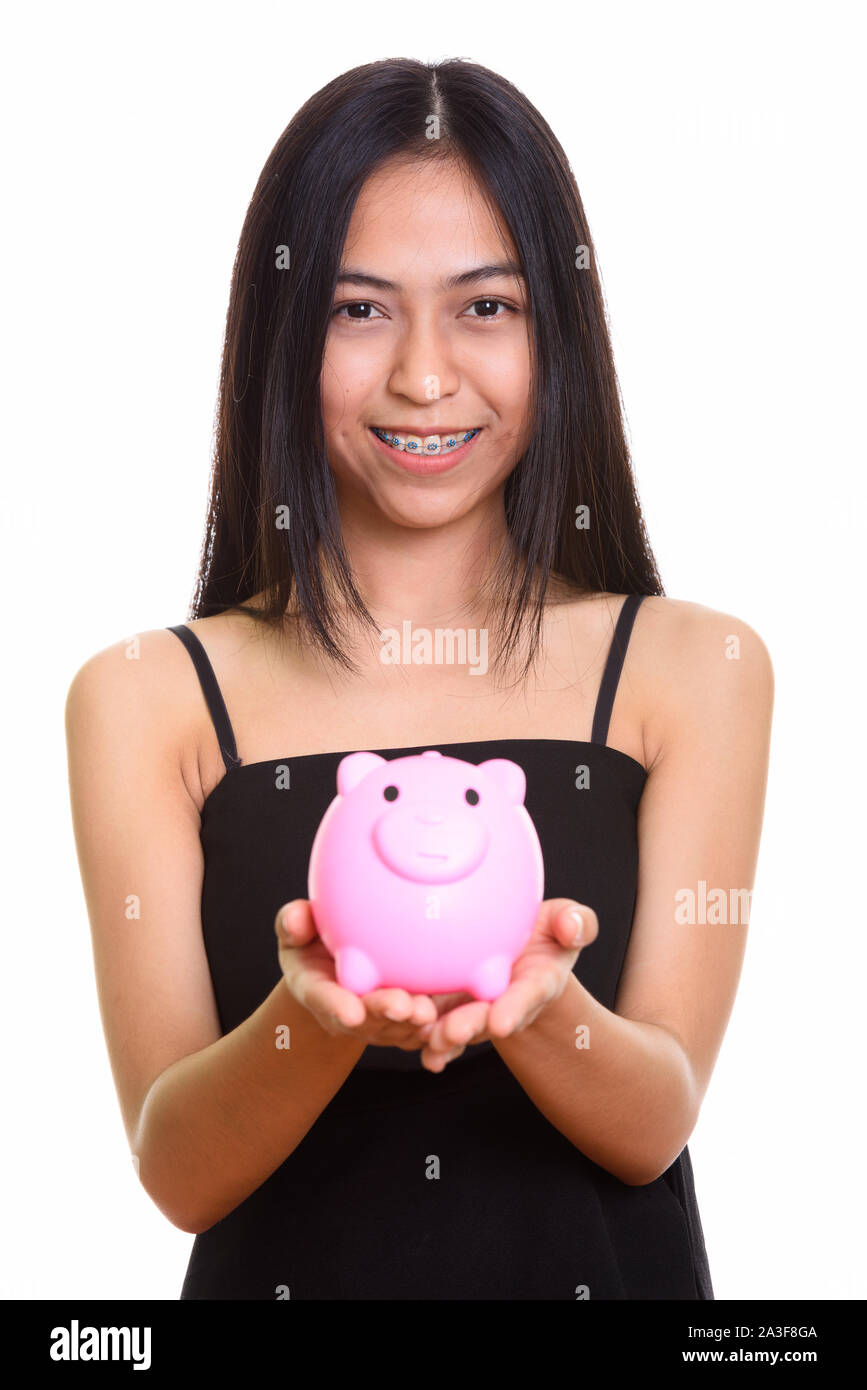 Close up of young happy Asian teenage girl smiling while holding Stock ...