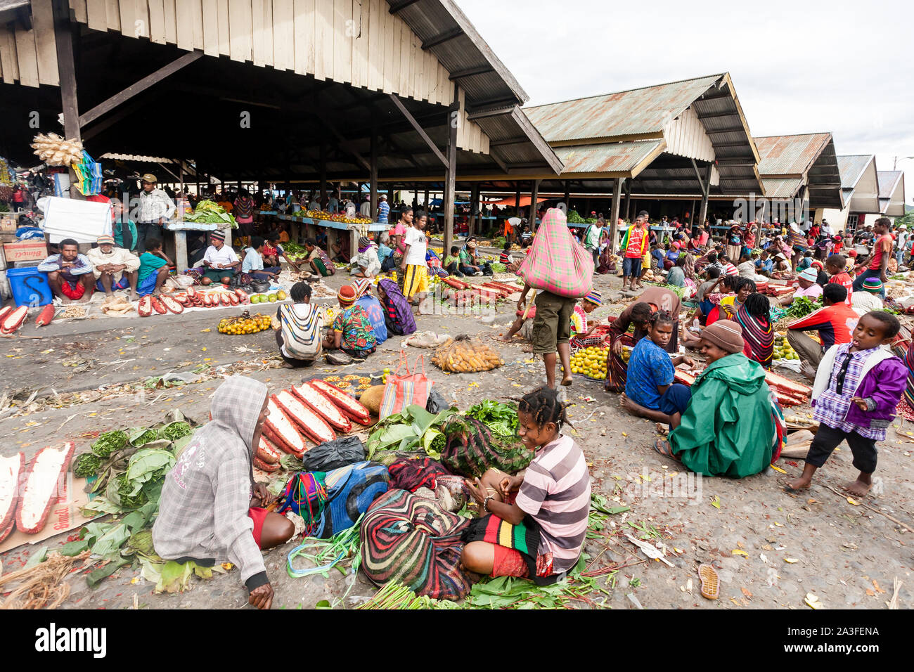 Wamena, Indonesia - January 9, 2010: Dani people are at the local market of Wamena in Baliem Valley, Papua New Guinea. Stock Photo