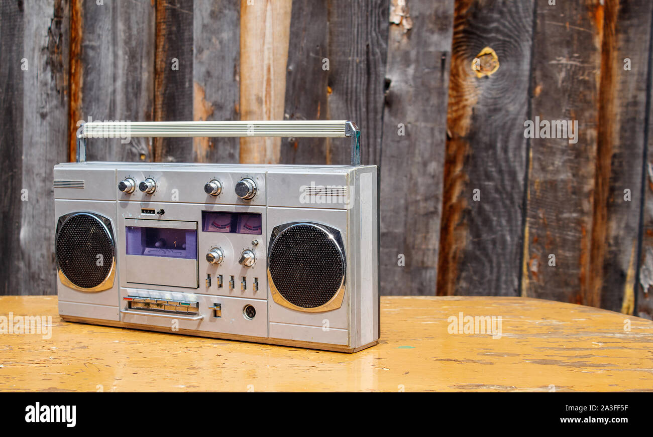 retro cassette player on wooden table outdoor closeup Stock Photo
