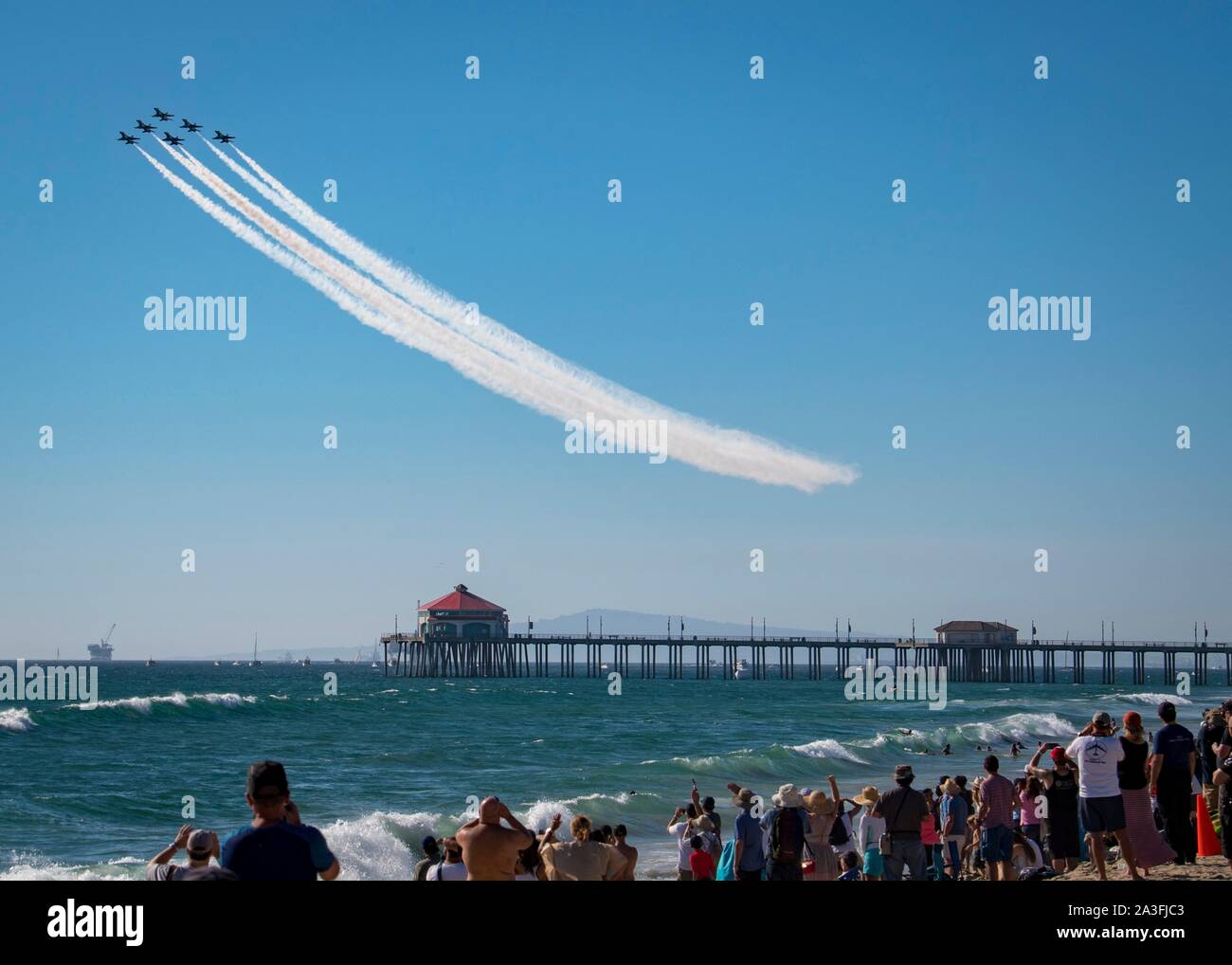 The U.S. Air Force Thunderbirds Air Demonstration Squadron swoop over the famous Huntington Beach Pier during a flyover at the Great Pacific Air Show October 6, 2019 in Huntington Beach, California. Stock Photo