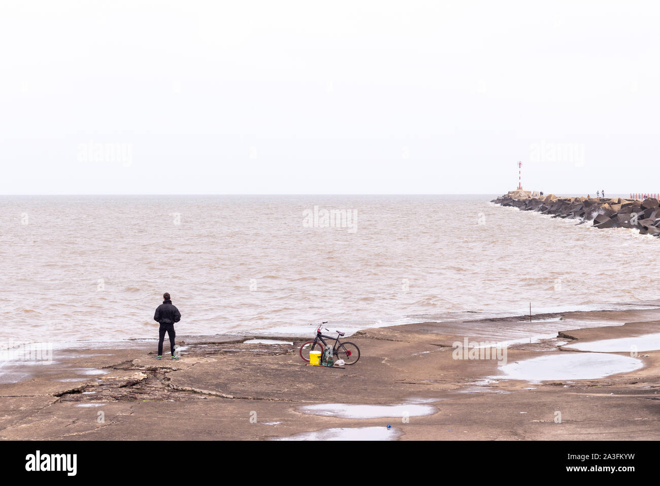 Man fishing at Montevideo Port, Uruguay Stock Photo