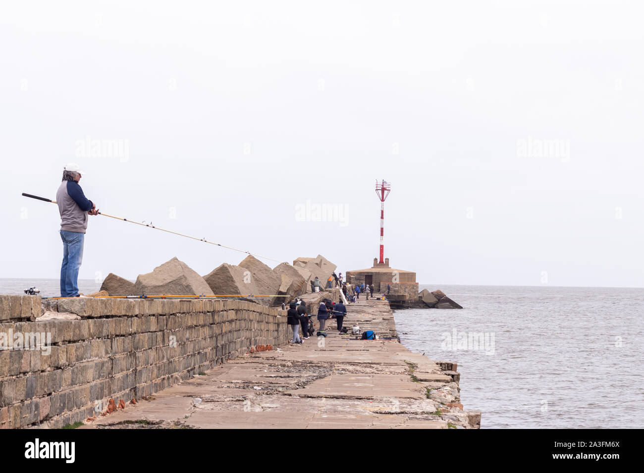People fishing at Montevideo Port, Uruguay Stock Photo