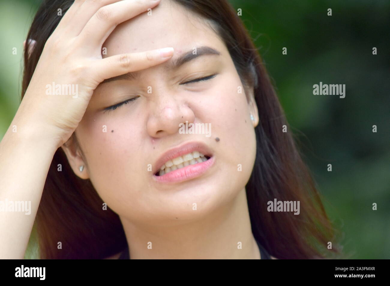 A Filipina Woman And Anxiety Stock Photo