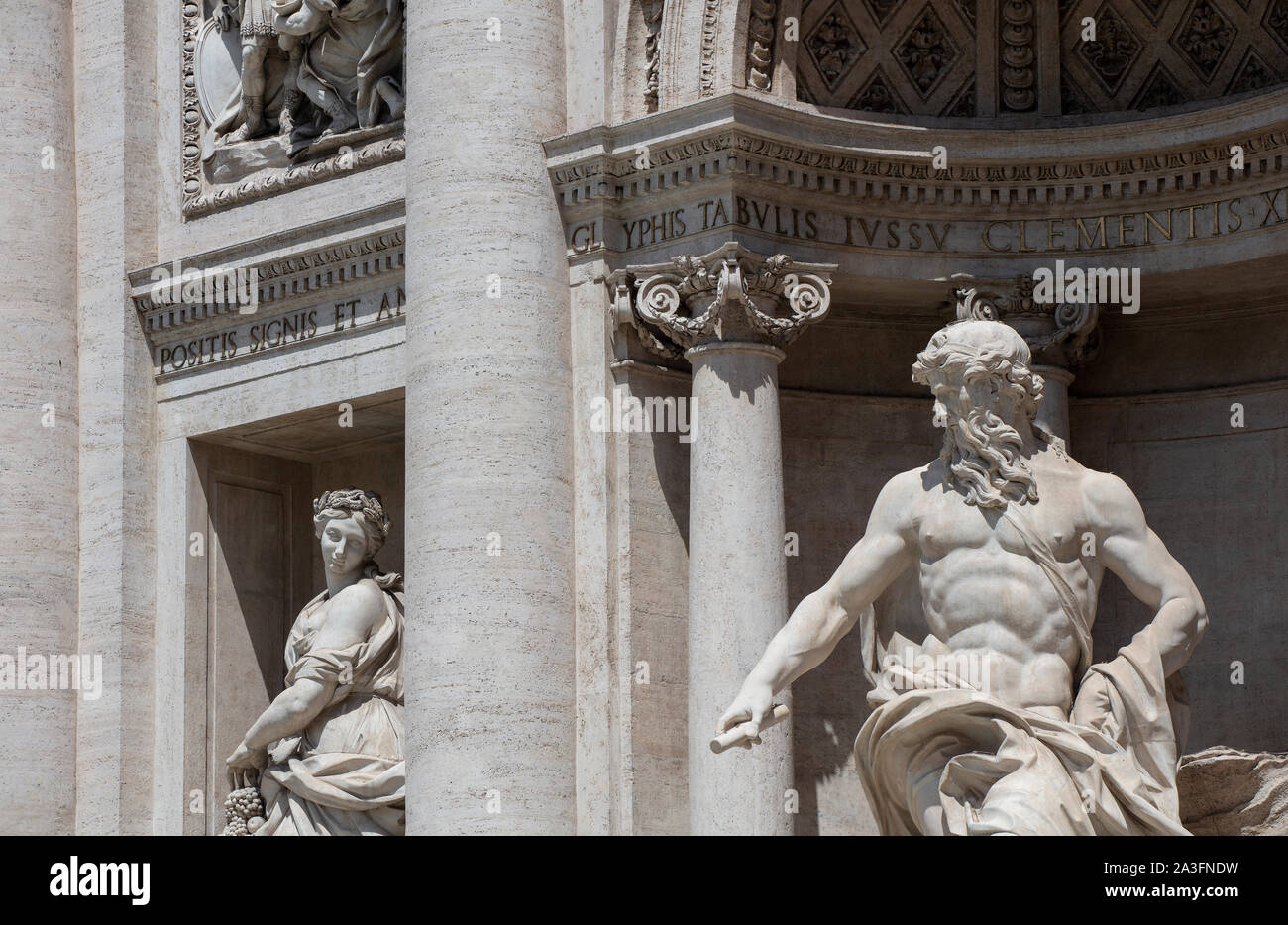 Detail of the two statues Oceanus (in the centre of the fountain) and Abundance on the famous Trevi Fountain, a major tourist attraction in Rome. Stock Photo
