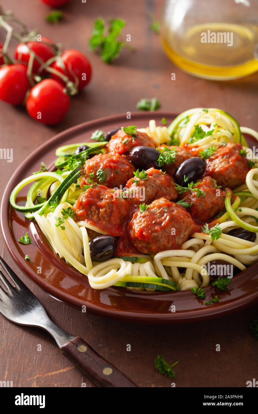 keto paleo zoodles zucchini noodles with meatballs and olives Stock