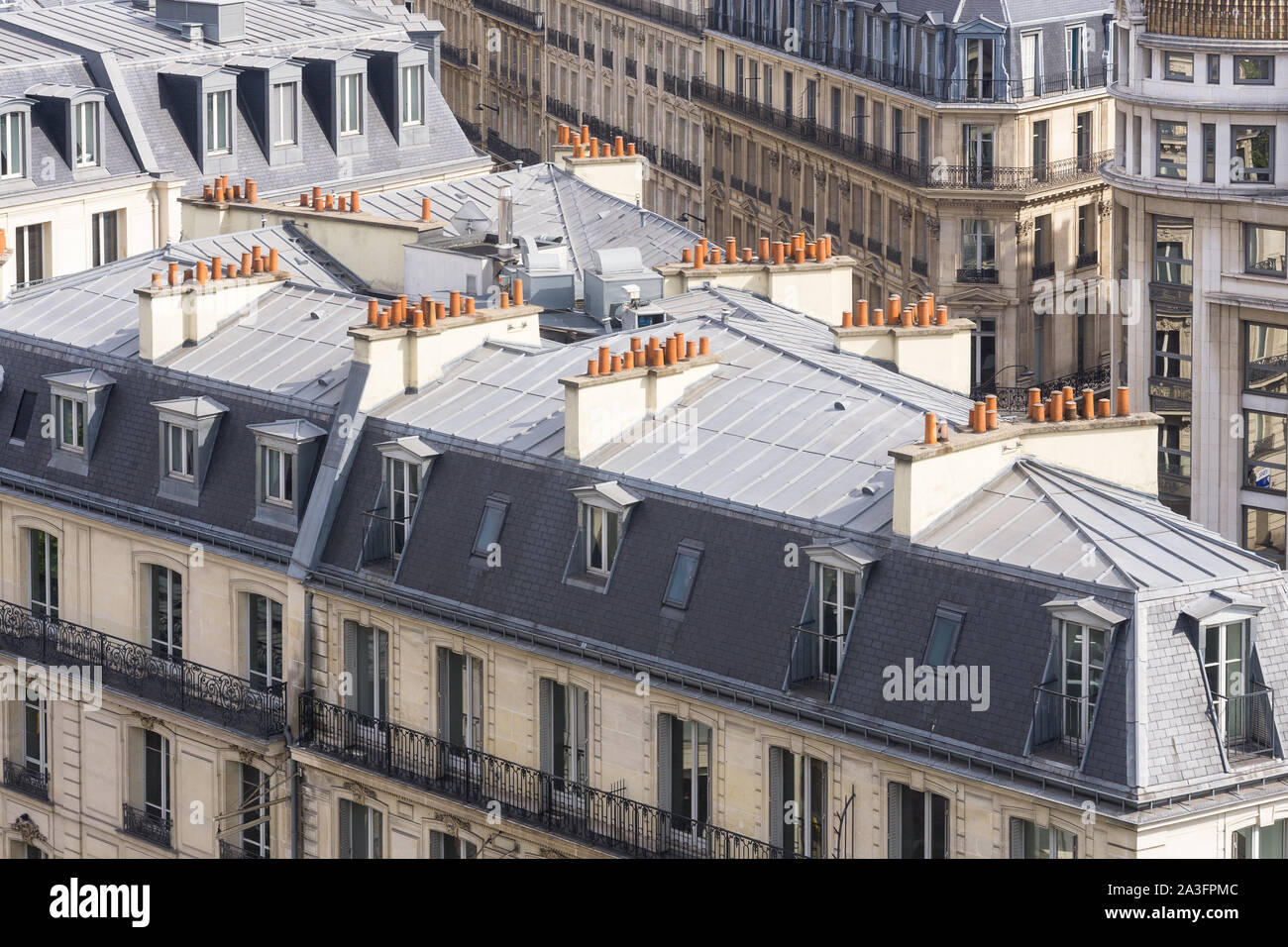 Paris roofs - Typical roof of a Haussmann-style building in Paris with chimneypots. France, Europe. Stock Photo