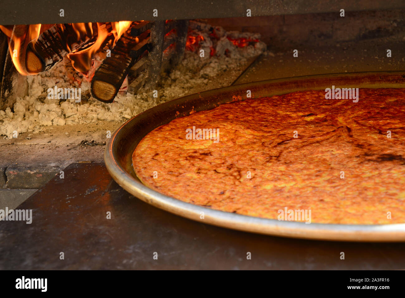 Chickpea Farinata or Cecina Cooking in WoodBurning Professional Oven
