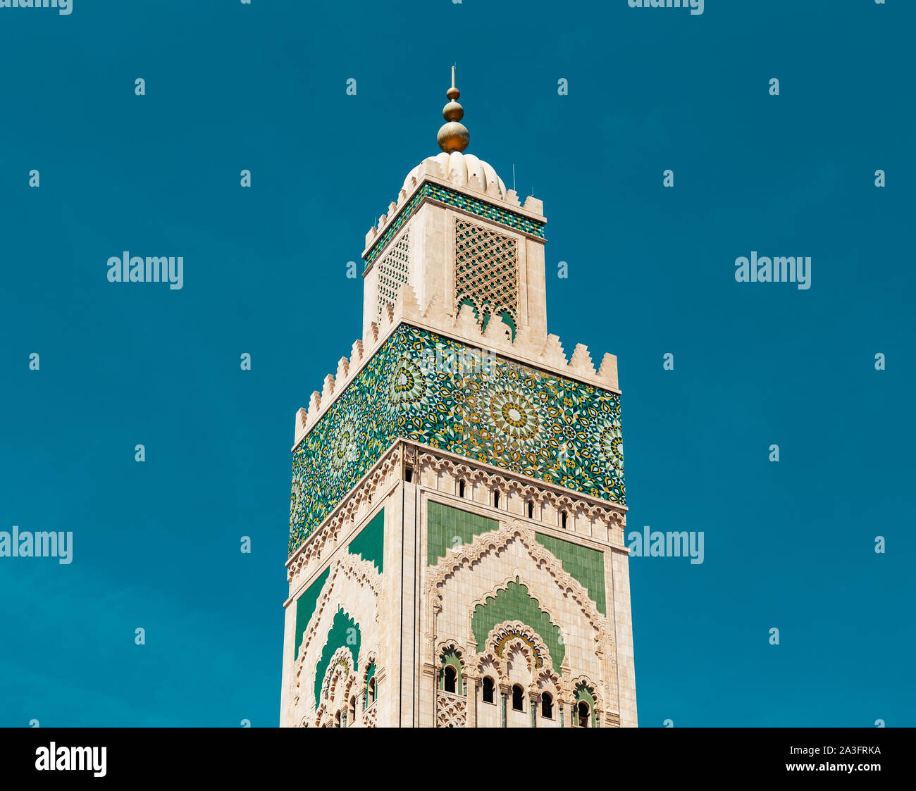 low angle view of Hassan II mosque's minaret in the middle of the day Stock Photo