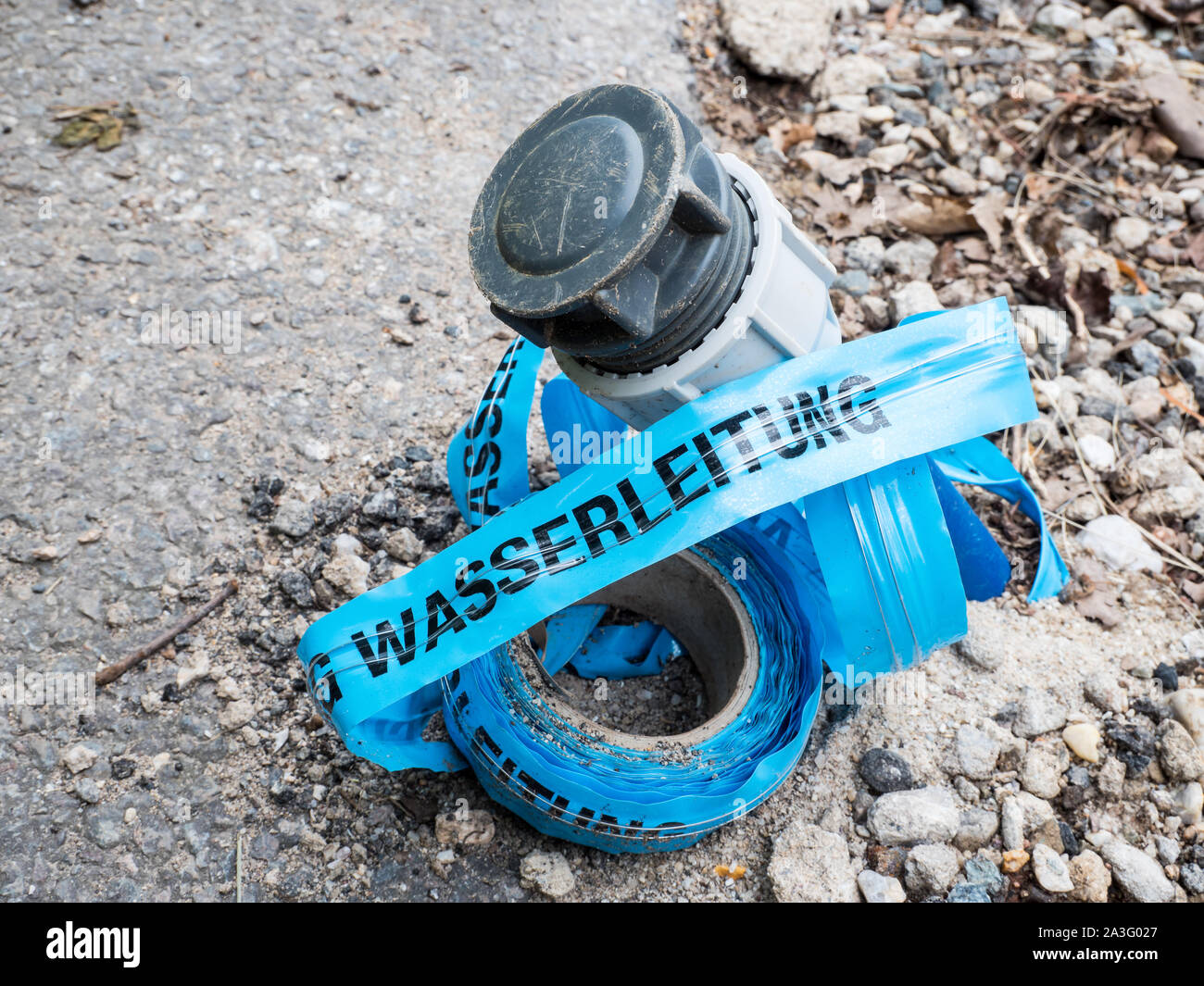 Track warning tape water pipe with water pipe Stock Photo Alamy
