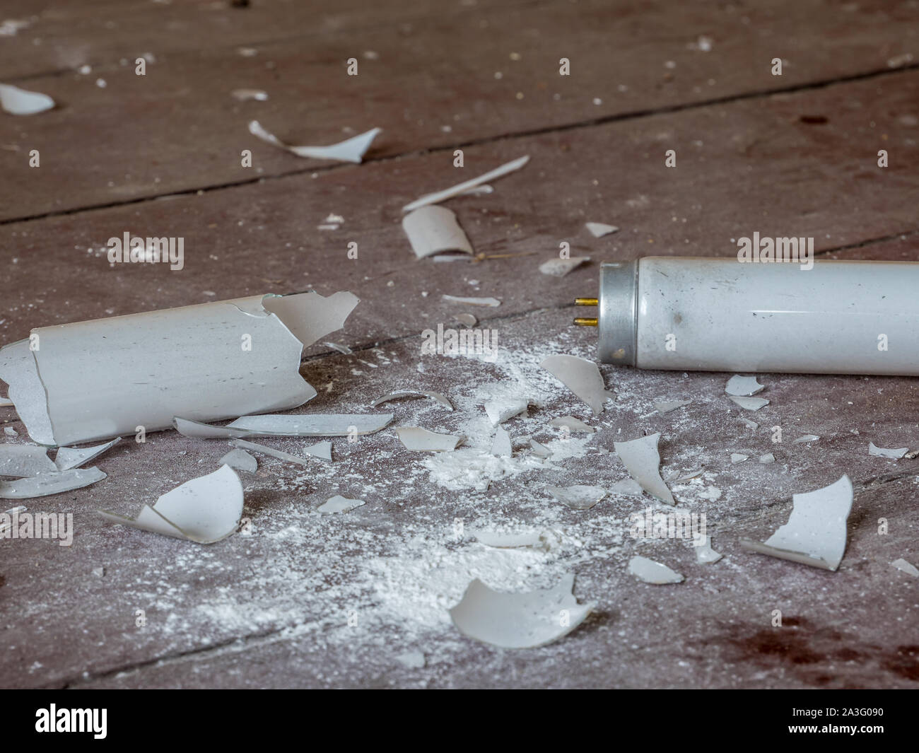 Caution mercury vapor with broken fluorescent tube Stock Photo Alamy