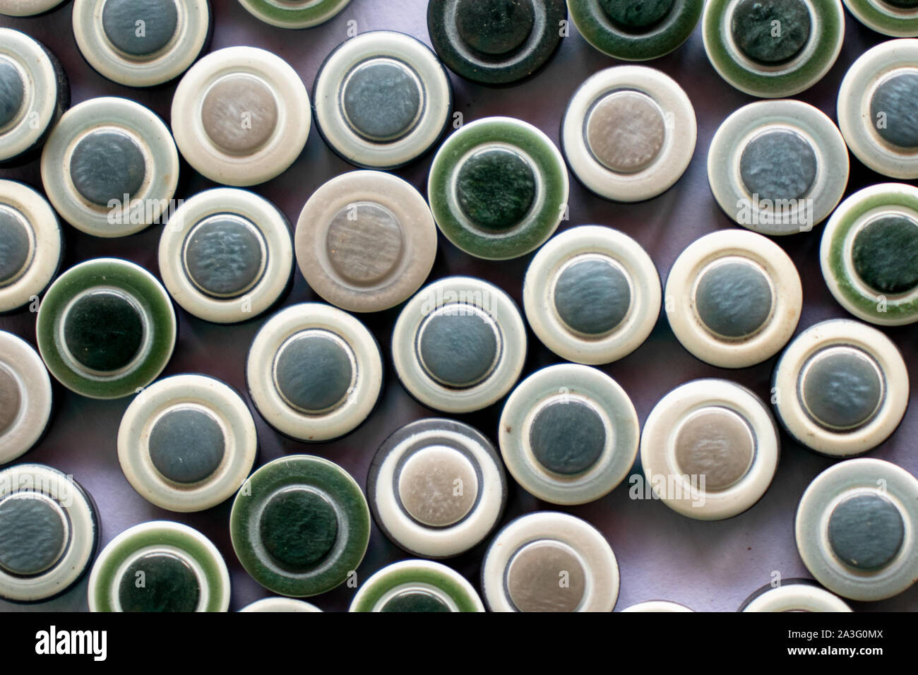 green sewing buttons on white Stock Photo - Alamy