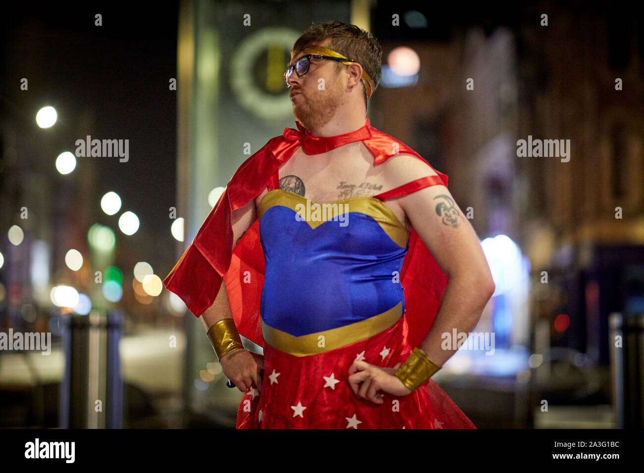 Cardiff Wales, man dressed in fancy dress as Wonderwoman Stock Photo