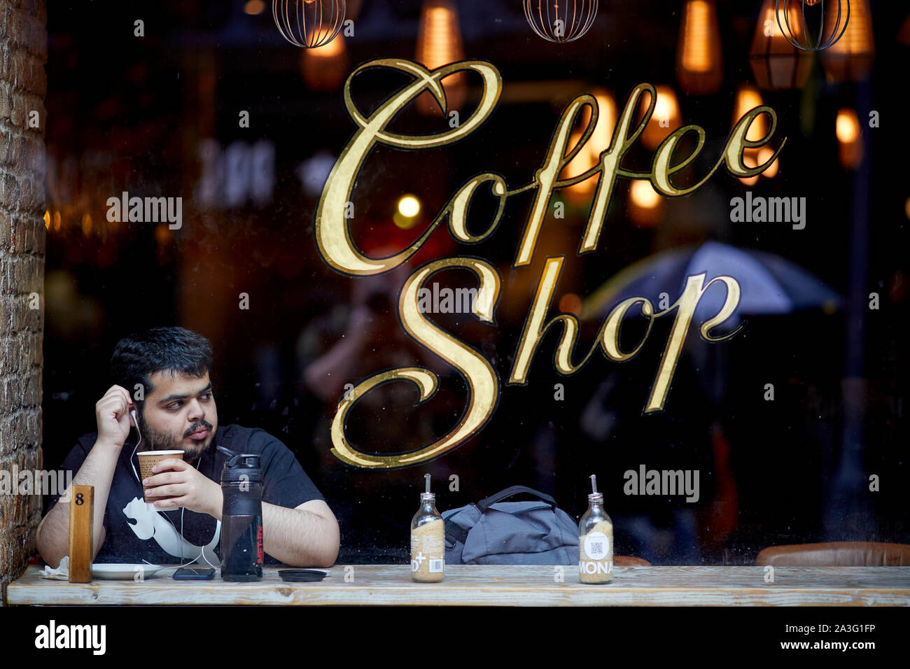 Cardiff Wales, customer in the window of a coffee shop Stock Photo Alamy