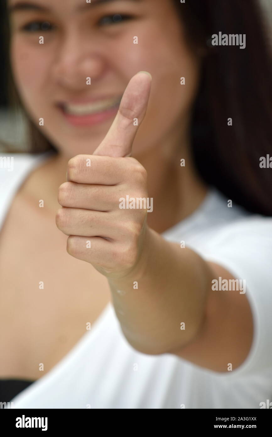 Pretty Minority Female With Thumbs Up Stock Photo