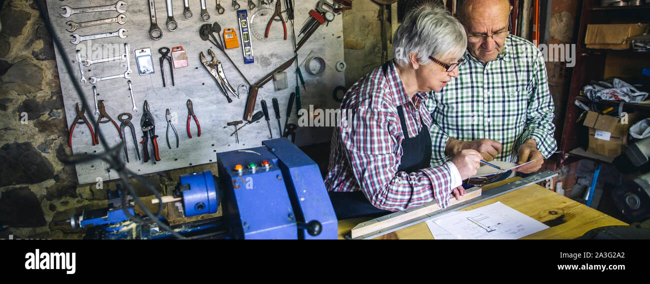Senior couple in a carpentry Stock Photo