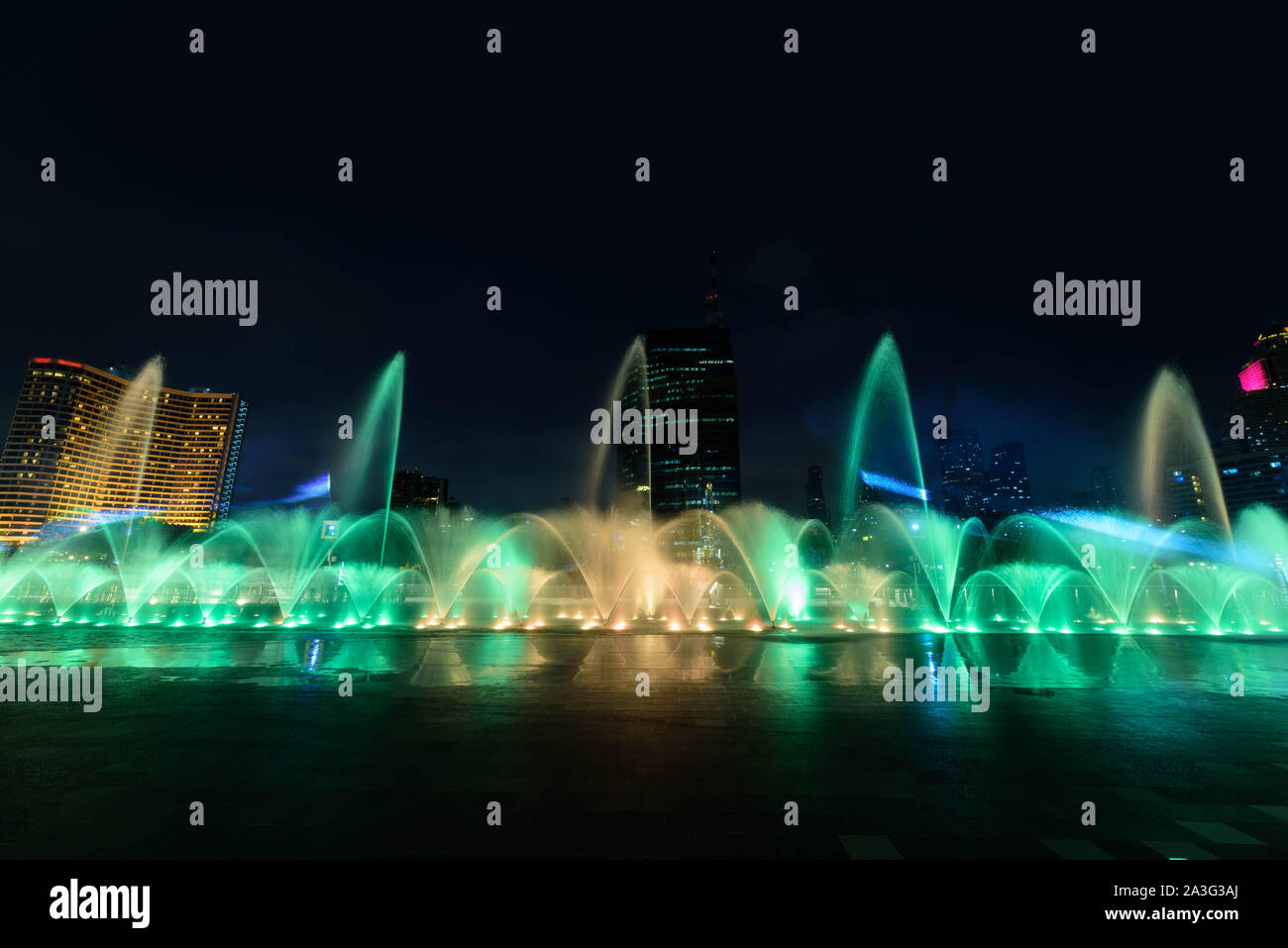 the fountain showing with lighting in night time Stock Photo - Alamy