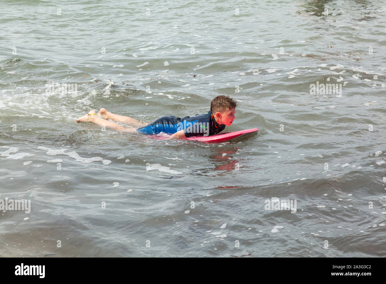 Boy Swimming Sea Wetsuit High Resolution Stock Photography and Images