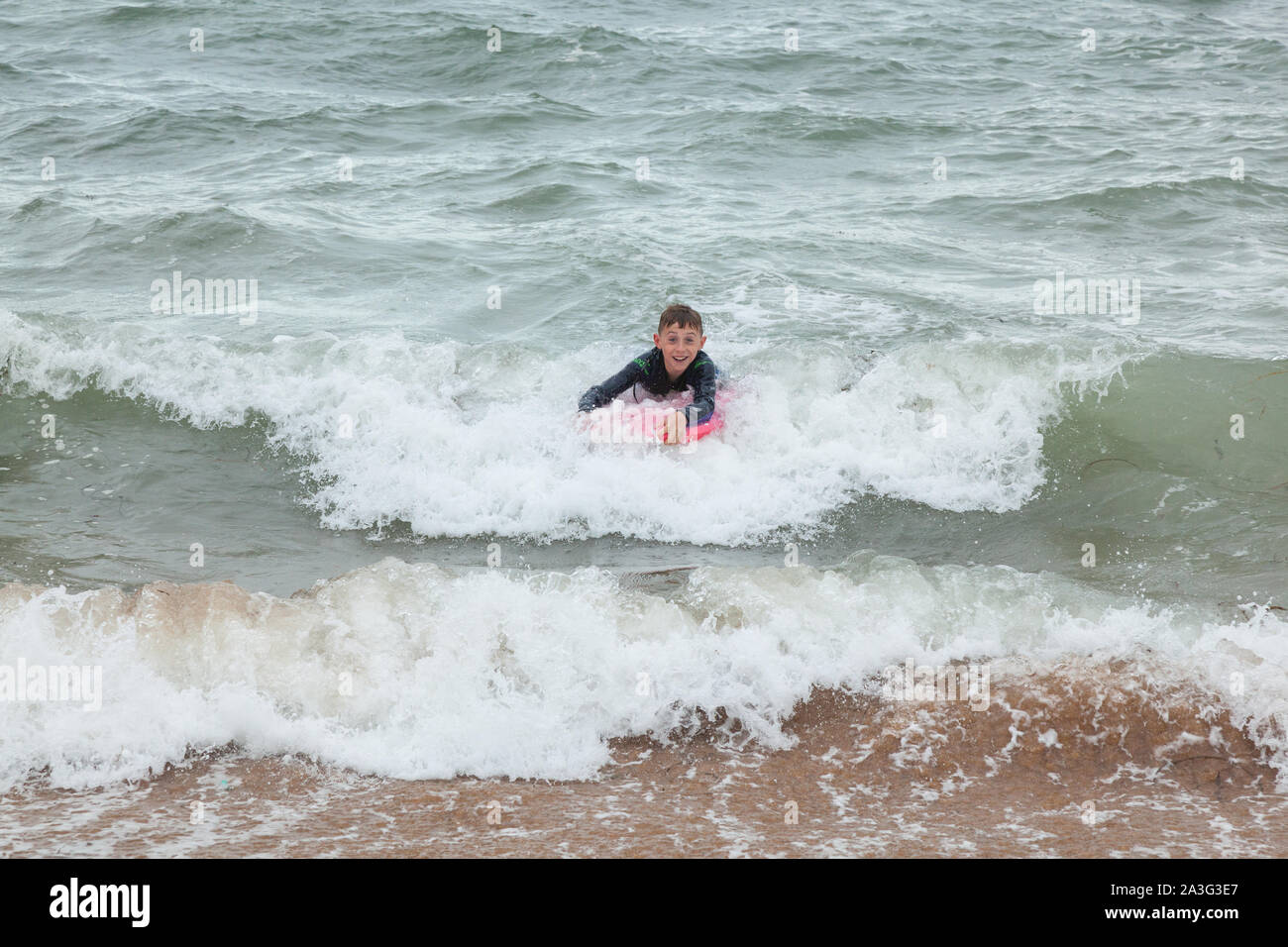 Boy Swimming Sea Wetsuit High Resolution Stock Photography and Images
