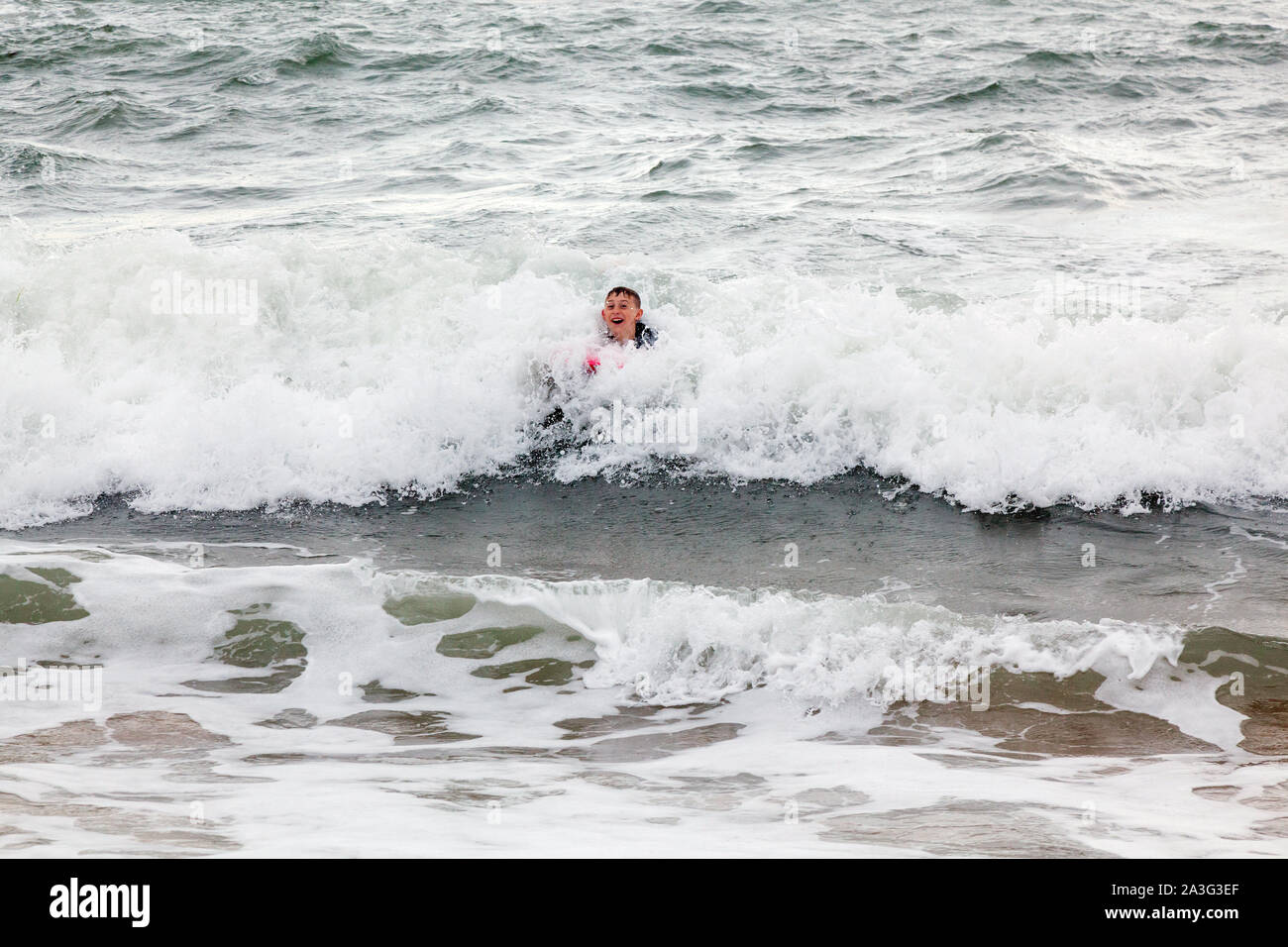 Boy Swimming Sea Wetsuit High Resolution Stock Photography and Images