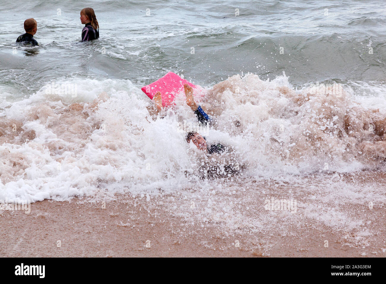 Boy swimming sea wetsuit hires stock photography and images Alamy