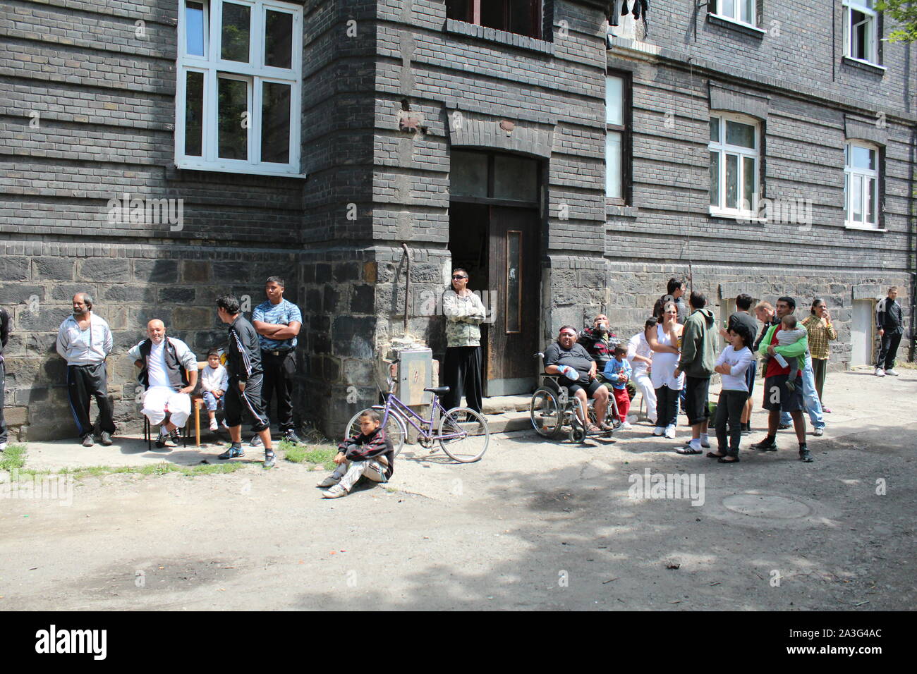 PREROV, CZECH REPUBLIC JUNE 25, 2011: Ghetto in Prerov, Husova street with courtyard Gypsy residents, authentic real situations, Europe, EU Stock Photo