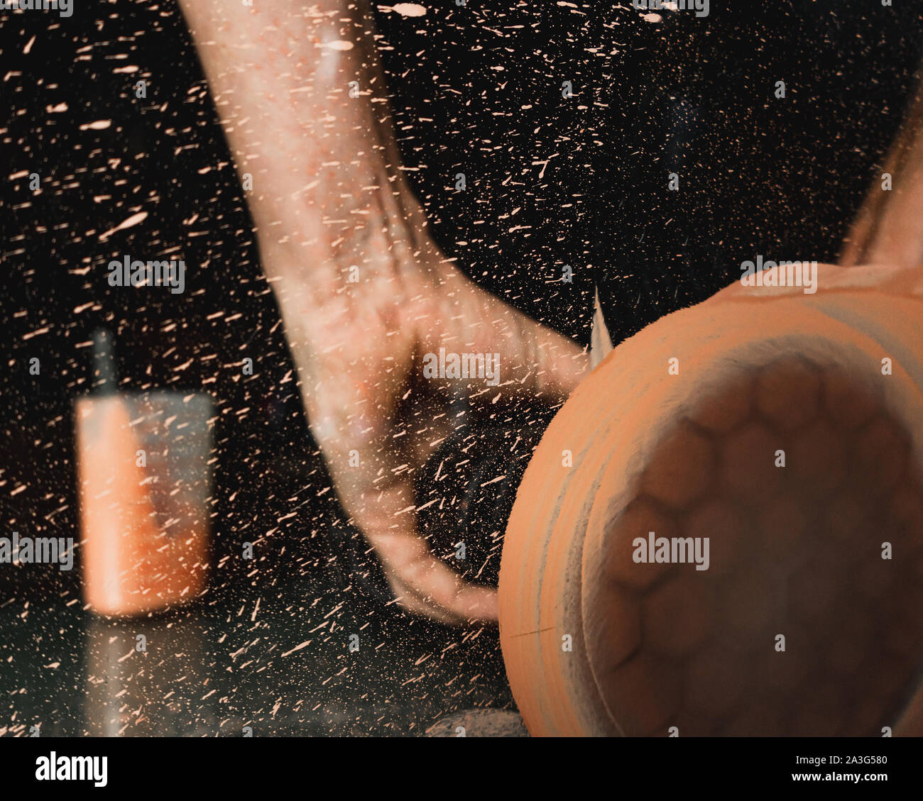 Mechanic using professional glass polishing tool to remove scratches