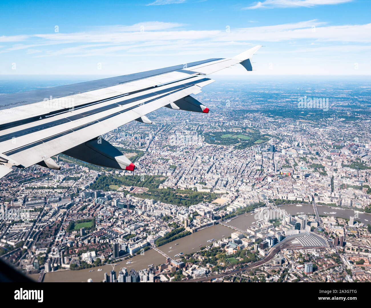 View from plane window over River Thames & Westminster: London Eye, St James Park, Regent's Park & Waterloo station, London, England, UK Stock Photo