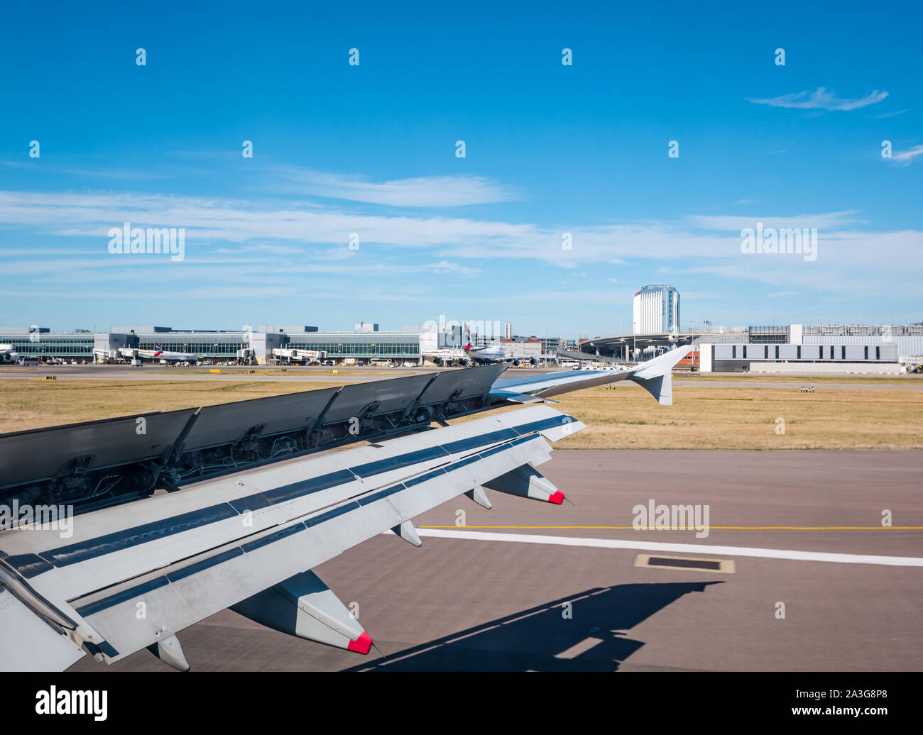 View from plane window of landing on runway, Terminal 5, Heathrow Airport, London, England, UK Stock Photo