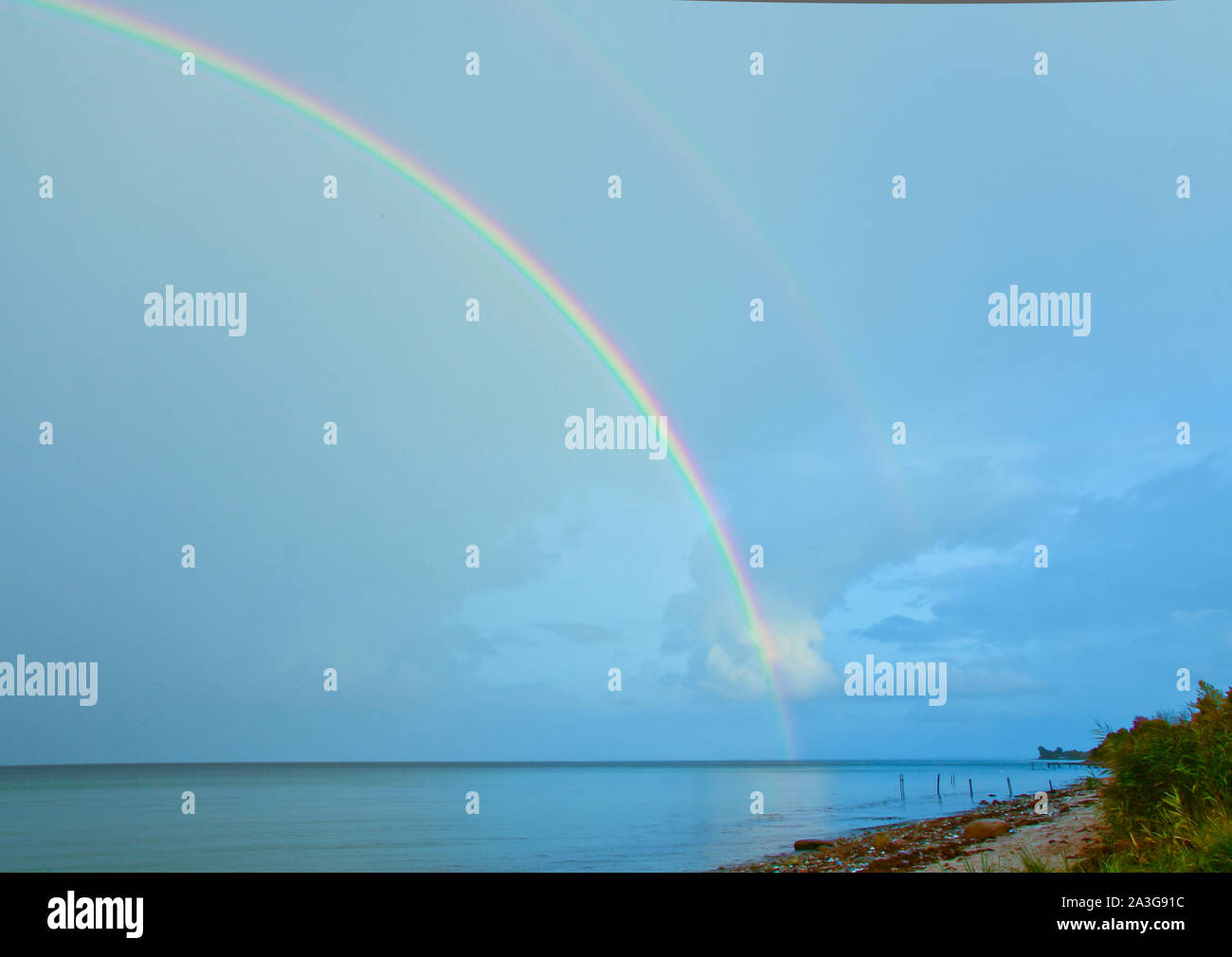 Beautiful Bright Lucent And Real Rainbow Across The Ocean Stock Photo Alamy