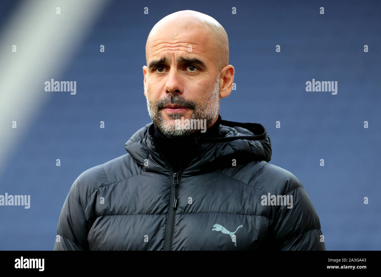 Manchester City manager Pep Guardiola inspects the pitch prior to kick-off during the Carabao Cup, Third Round match at Deepdale Stadium, Preston Stock Photo