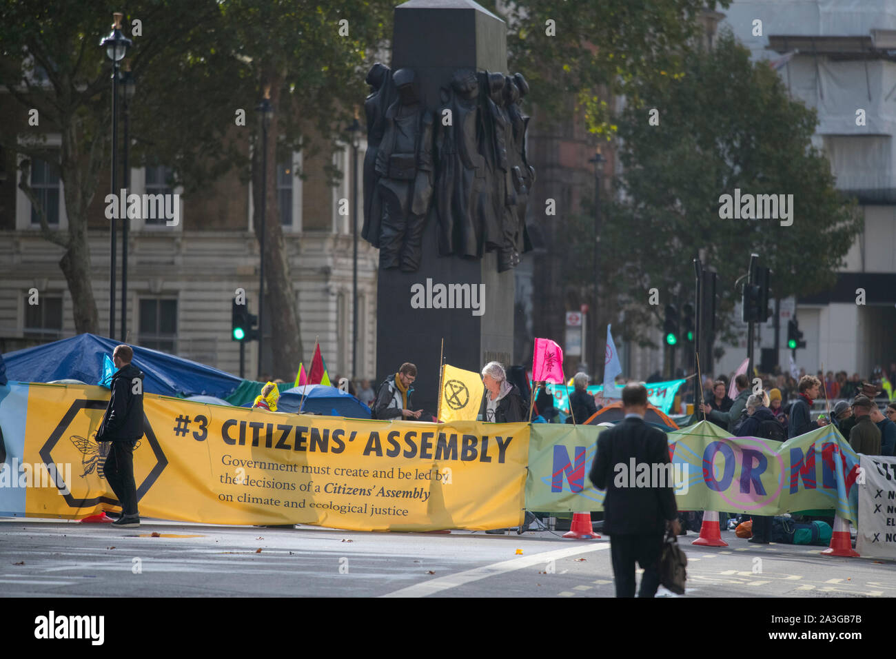 Westminster, London, UK. 8th October 2019. Extinction Rebellion activists block roads around Westminster in a second day of climate-change demonstrations. Whitehall is closed as demonstrators assemble close to the Downing Street entrance. Credit: Malcolm Park/Alamy Live News. Stock Photo
